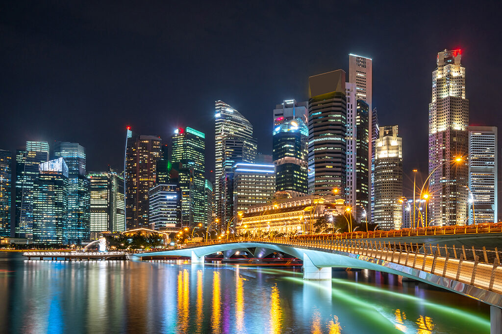 A nighttime view of a modern city skyline and bridge, representing the safe, well-lit environments that address the query: is Dubai safe for solo female travellers?