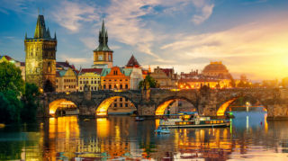 A breathtaking sunset over the Vltava River, highlighting one of the most picturesque things to do in Prague for couples.
