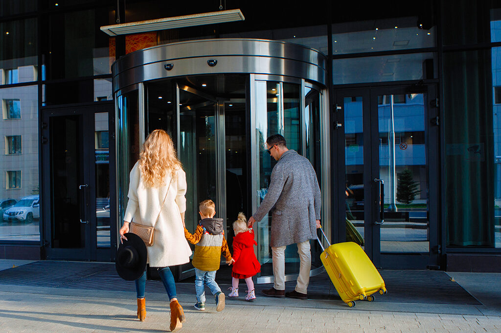 Family arriving hotel resort with luggage,Best Hotels Near Disneyland Paris- VGUK Blog