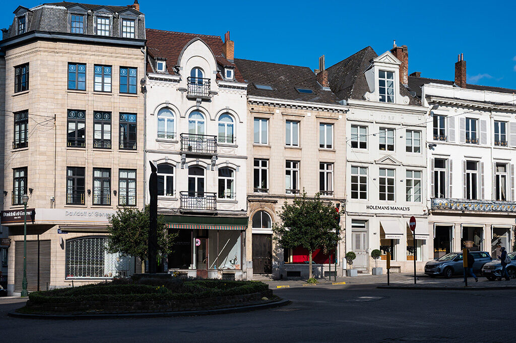 Elegant storefronts and antique shops lining the Place du Grand Sablon, highlighting the upscale atmosphere when considering where to stay in Brussels.