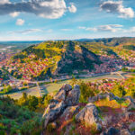 Panoramic view of Berat, Albania, showcasing its historic white Ottoman houses layered on a hillside, perfect for travelers researching the best places to stay in Albania.