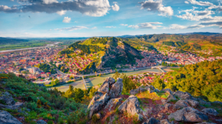 Panoramic view of Berat, Albania, showcasing its historic white Ottoman houses layered on a hillside, perfect for travelers researching the best places to stay in Albania.