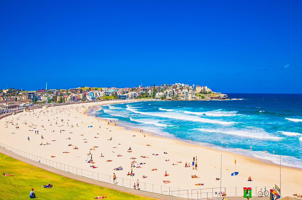 People relaxing on the Bondi beach in Sydney, Australia. Bondi beach is one of the most famous beach in the world and one of the best things to do in Sydney with kids.