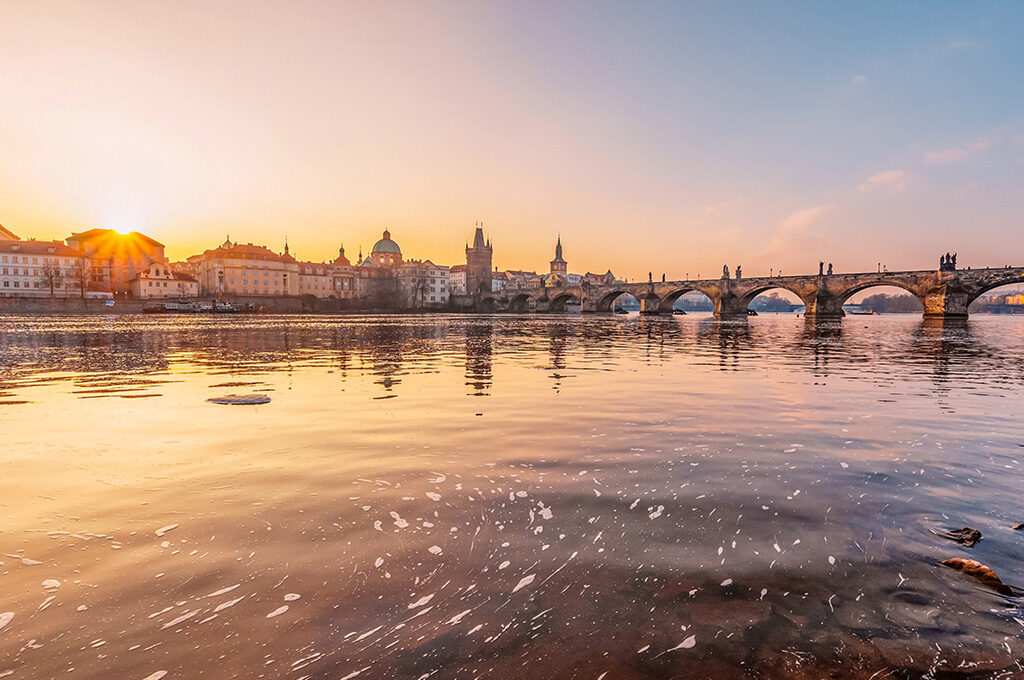 Golden sunrise over the Charles Bridge in Prague, one of the best Eastern European cities to visit.