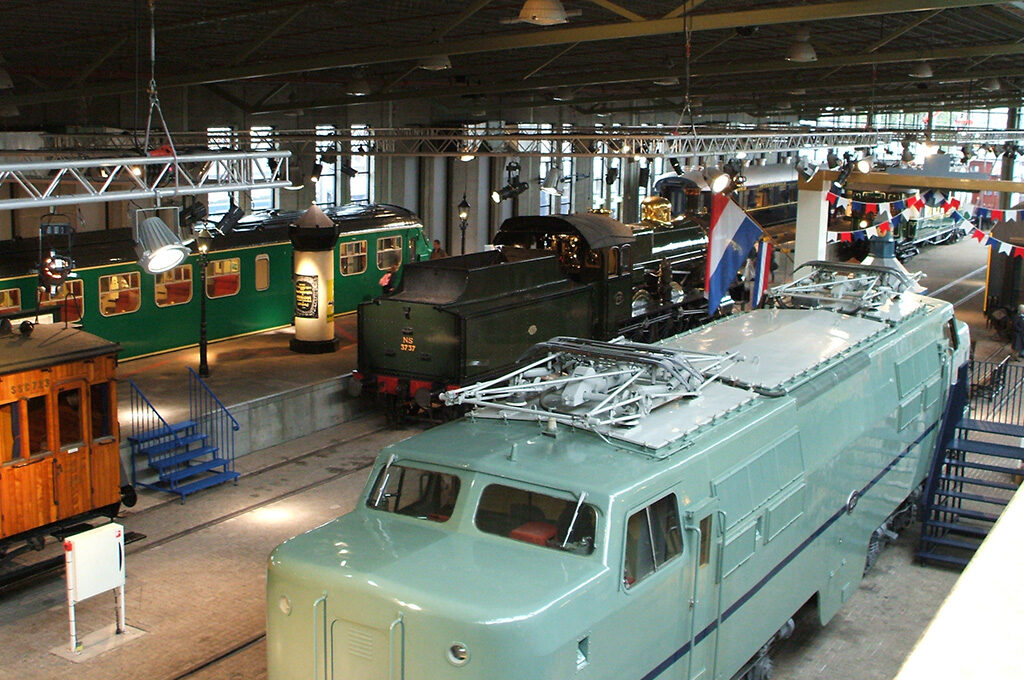 Historic steam trains and vintage railway vehicles at Railway Museum Utrecht - specialty places to visit in Netherlands with family for rail-enthusiast children and seasonal ice rink activities.