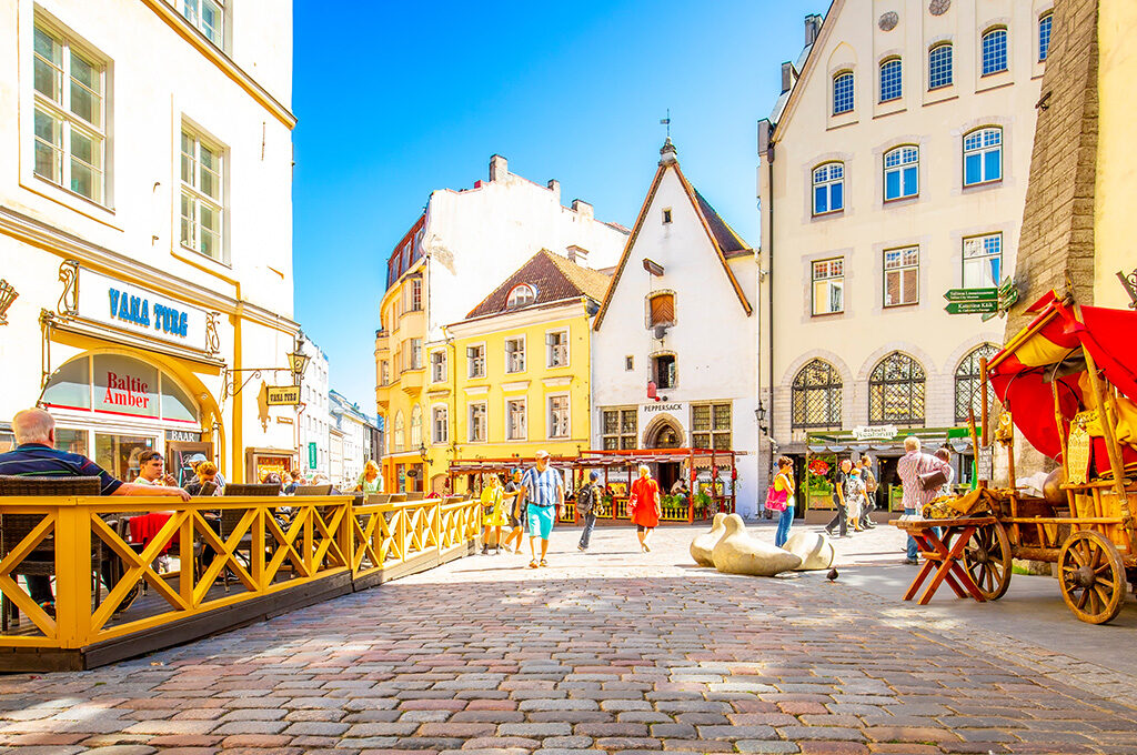 Vibrant cobblestone street and medieval buildings in Tallinn Old Town, one of the best Eastern European cities to visit.
