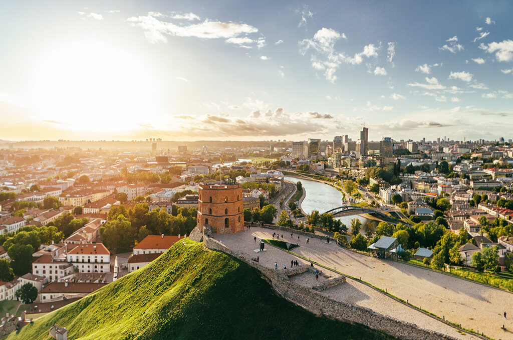 Aerial view of Vilnius Old Town and the Neris River at sunset, highlighted as one of the best Eastern European cities to visit.