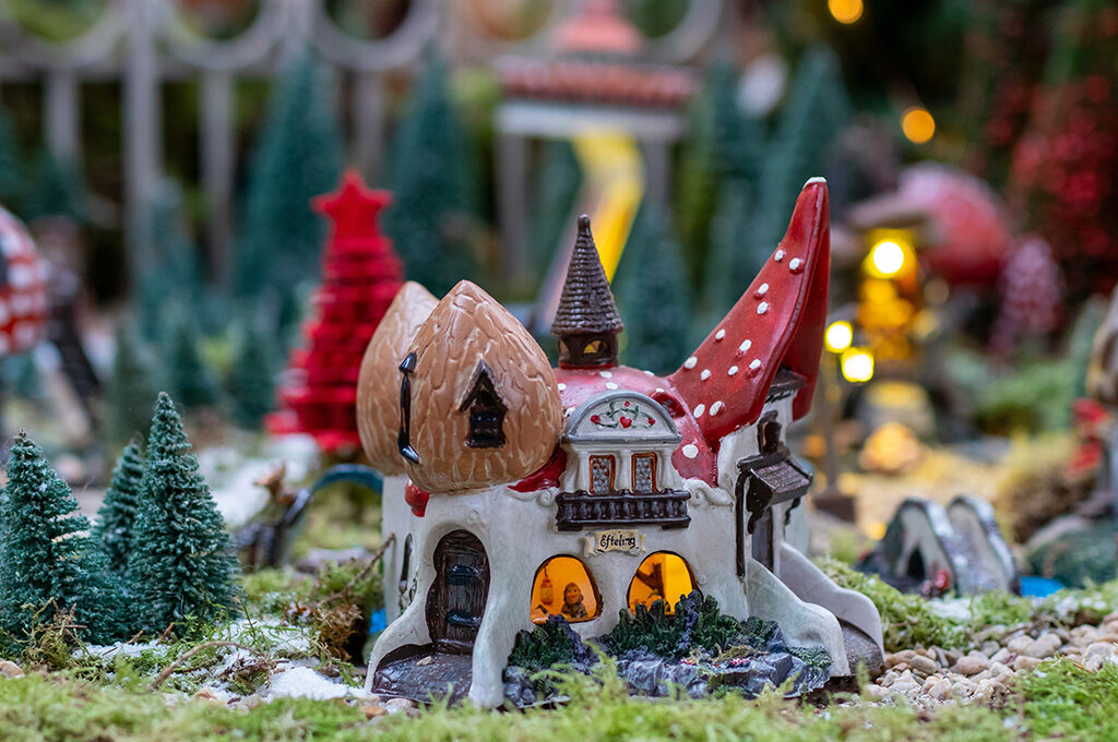 Miniature illuminated fairytale village display - festive places to visit in Netherlands with family during Winter Efteling or Intratuin Kerstshow from late November.