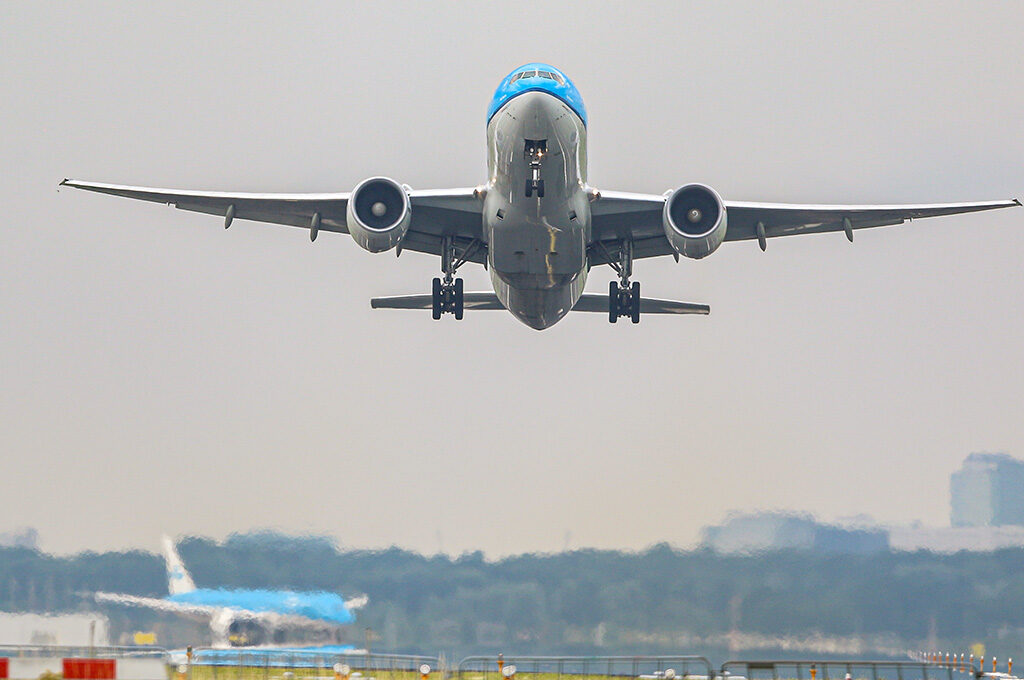 Commercial aircraft approaching Schiphol Airport Amsterdam - gateway to places to visit in Netherlands with family via direct UK flights under two hours.
