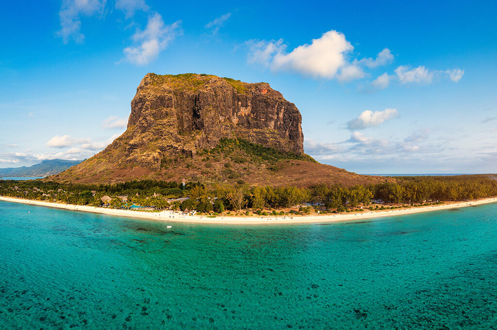 Aerial view of Le Morne Brabant mountain and turquoise ocean beach resort near the best hotels in mauritius.