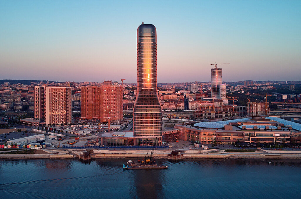 Modern Belgrade Waterfront skyline and Kula Belgrade tower at sunset, one of the best Eastern European cities to visit.