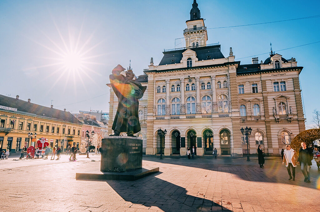 Sunlit Liberty Square and City Hall with the Svetozar Miletić monument in Novi Sad, one of the best Eastern European cities to visit.