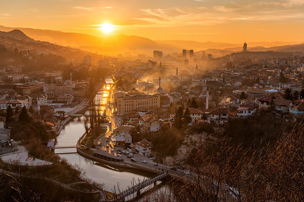 Golden sunset over the valley city of Sarajevo, featured among the best Eastern European cities to visit.