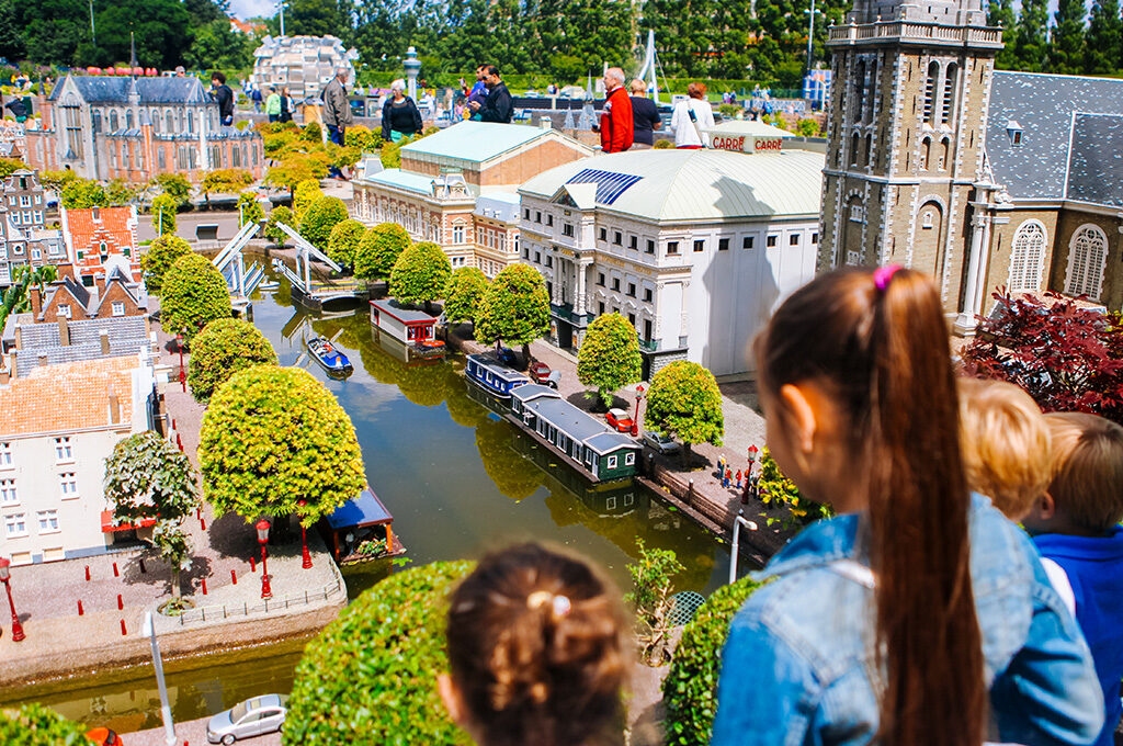 Madurodam miniature park in Den Haag featuring 1:25 scale model of Dutch cities with working canals and tiny boats - one of the best places to visit in Netherlands with family for younger children.