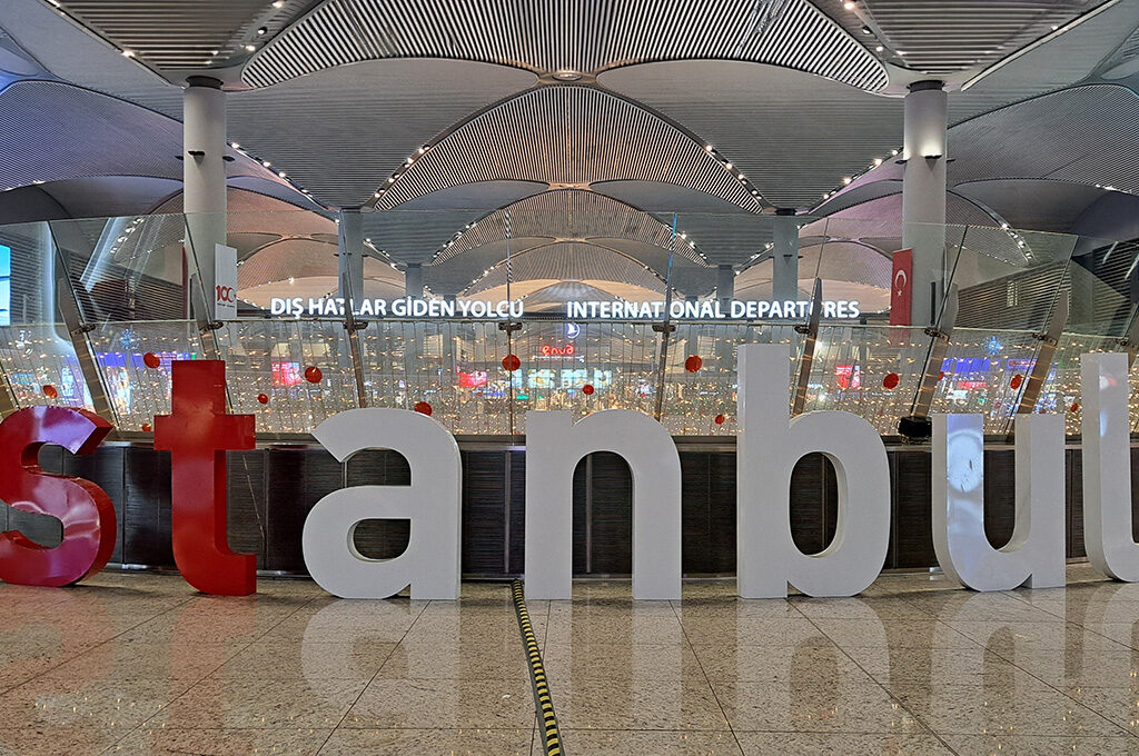 Large 3D landmark sign reading "istanbul" at the international departures terminal of Istanbul Airport, one of the busiest airports in Europe connecting international travelers.