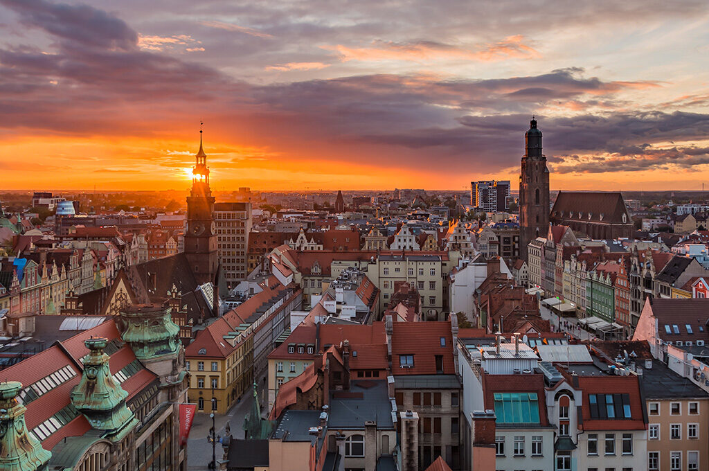 Panoramic aerial view of Wrocław Old Town during golden hour, highlighting top destinations in Poland.