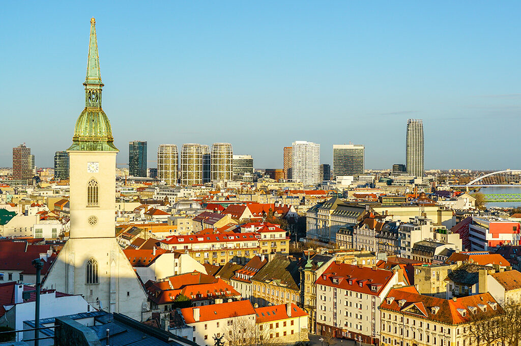 Skyline view of Bratislava Old Town and modern high-rises in Slovakia, highlighted as a top Eastern European travel destination.
